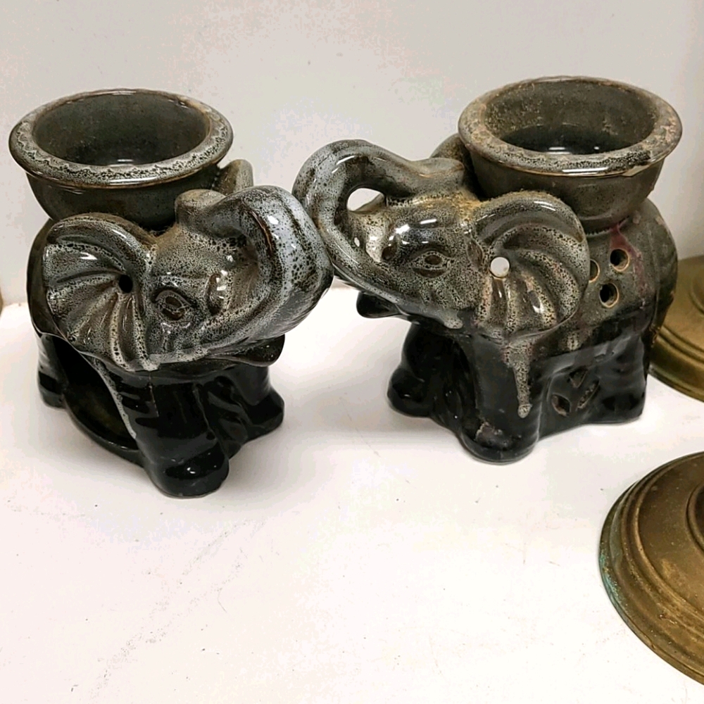2 Ceramic elephant candle holders with  trunks up